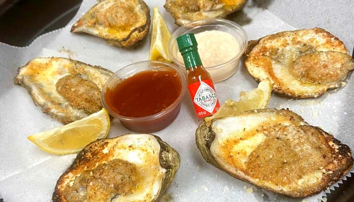 Fresh chargrilled oysters served at Scooter's Fish House best seafood restaurant in Navarre Florida